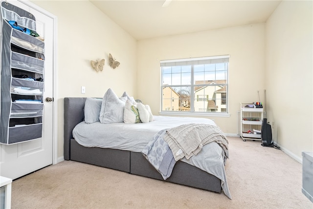 bedroom with light colored carpet