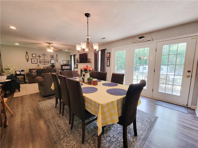 2580 Lee Road 148, Opelika, AL 36804 - dining space featuring a textured ceiling, dark wood finished floors, a chandelier, recessed lighting, and a ceiling fan