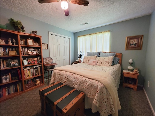 2580 Lee Road 148, Opelika, AL 36804 - carpeted bedroom with a closet, a textured ceiling, and ceiling fan