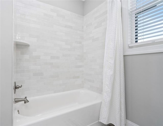 bathroom with shower / tub combo