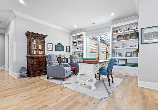 office area with crown molding and light hardwood / wood-style flooring