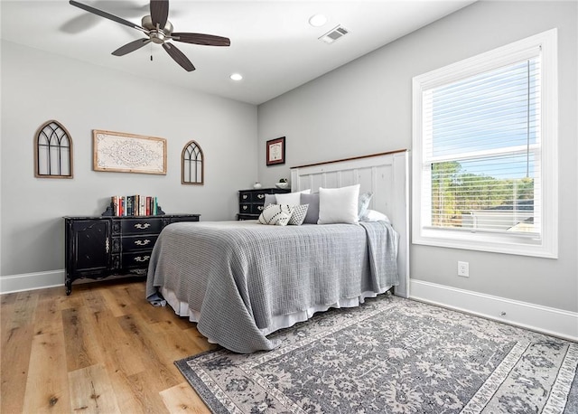 bedroom featuring ceiling fan and hardwood / wood-style flooring