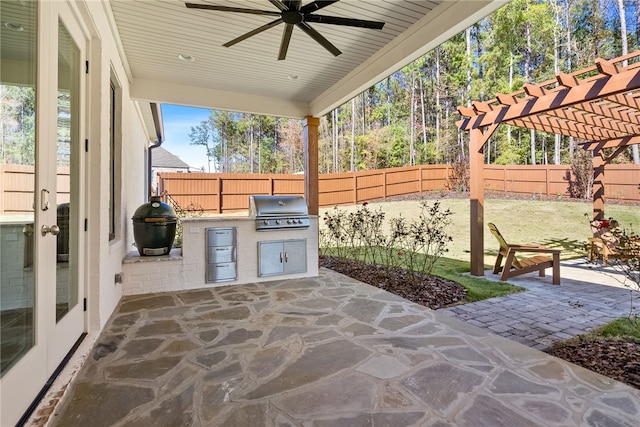 view of patio with a pergola, a grill, and french doors