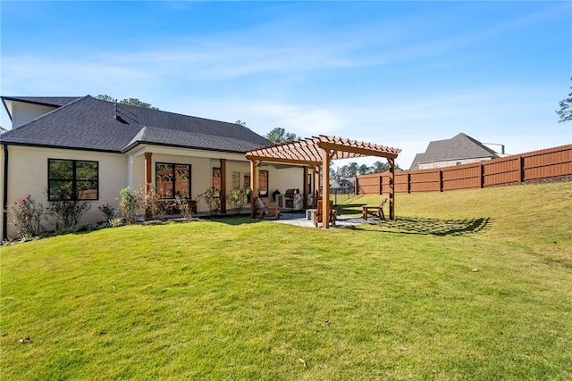 back of house with a pergola, a yard, and a patio