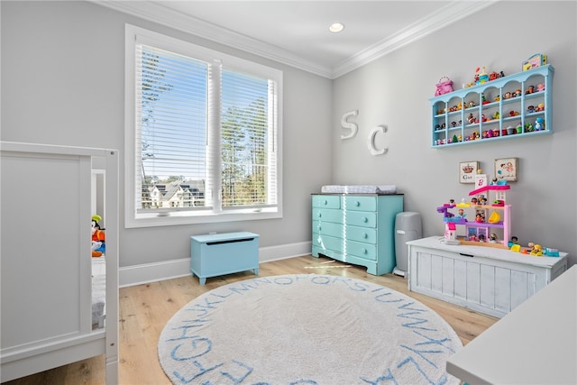 bedroom with hardwood / wood-style flooring and crown molding