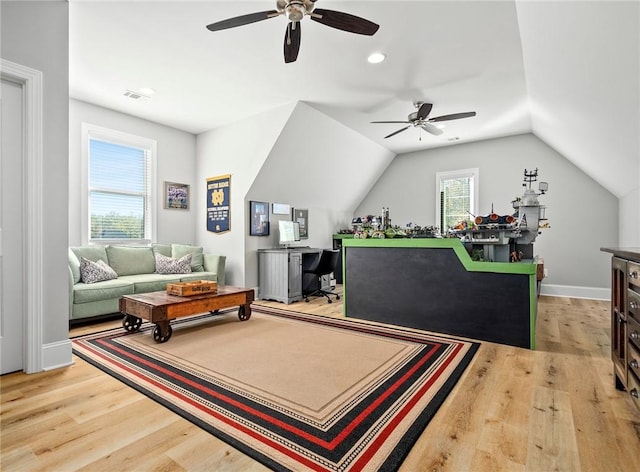 interior space with light hardwood / wood-style floors and lofted ceiling