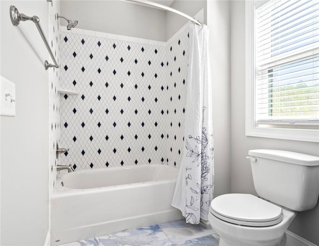 bathroom with shower / tub combo and toilet