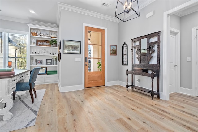 office area with light wood-type flooring, an inviting chandelier, and ornamental molding