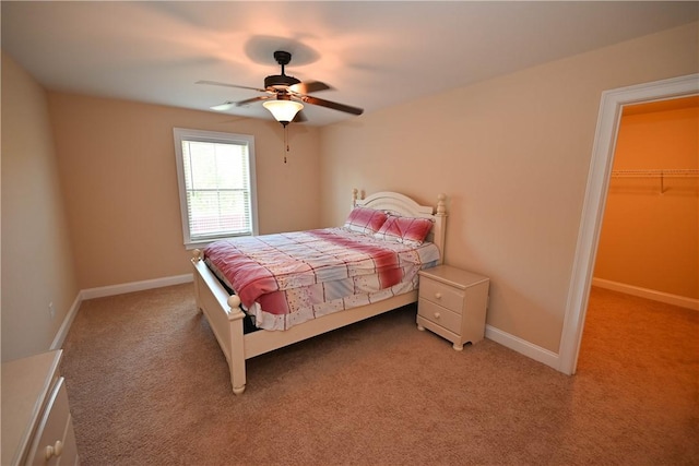 821 Whittington St, Auburn, AL 36832 - bedroom with light carpet, ceiling fan, baseboards, and a spacious closet