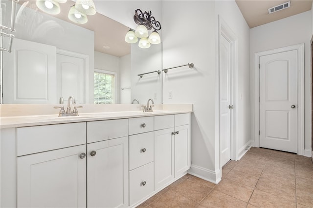 bathroom featuring tile patterned flooring and vanity