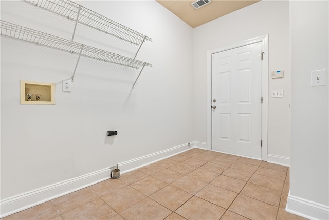 laundry room with light tile patterned flooring and washer hookup