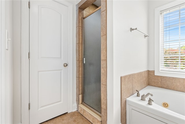 bathroom with tile patterned floors and plus walk in shower