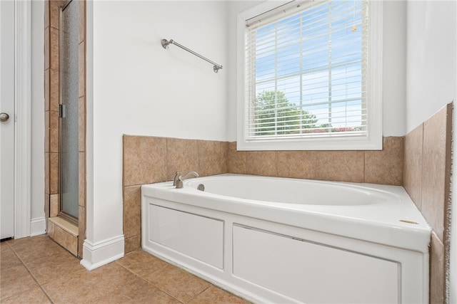 bathroom with plus walk in shower and tile patterned floors