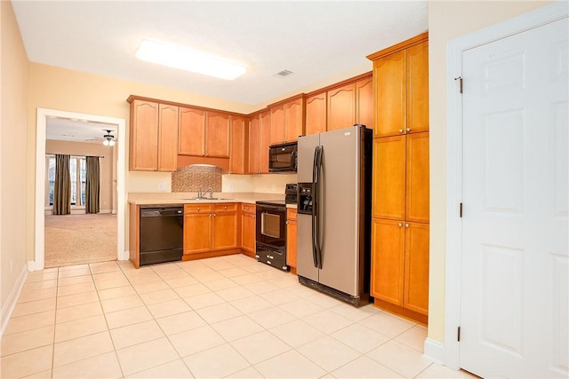 1630 Academy Dr Unit 404, Auburn, AL 36830 - kitchen with black appliances, light countertops, light tile patterned flooring, and ceiling fan