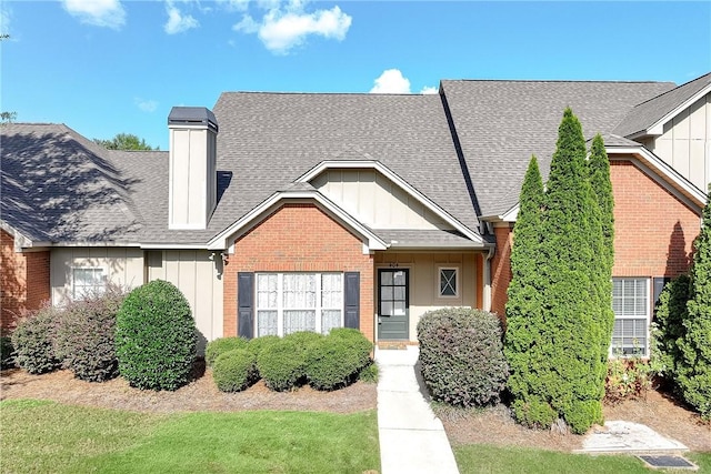 1630 Academy Dr Unit 404, Auburn, AL 36830 - view of front of home featuring board and batten siding, brick siding, and a shingled roof