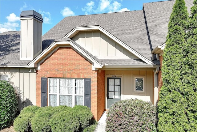 1630 Academy Dr Unit 404, Auburn, AL 36830 - exterior space featuring board and batten siding, brick siding, and roof with shingles