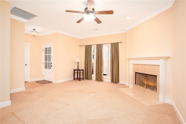 1630 Academy Dr Unit 404, Auburn, AL 36830 - unfurnished living room featuring carpet floors, a ceiling fan, ornamental molding, and a tiled fireplace