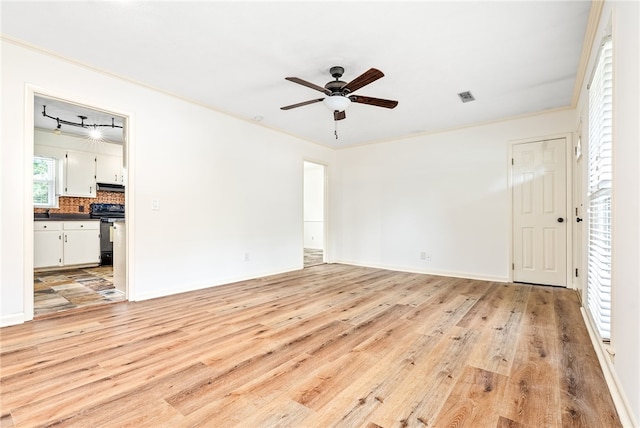 630 Apache St, Auburn, AL 36830 - empty room featuring light wood-style flooring, ceiling fan, and ornamental molding