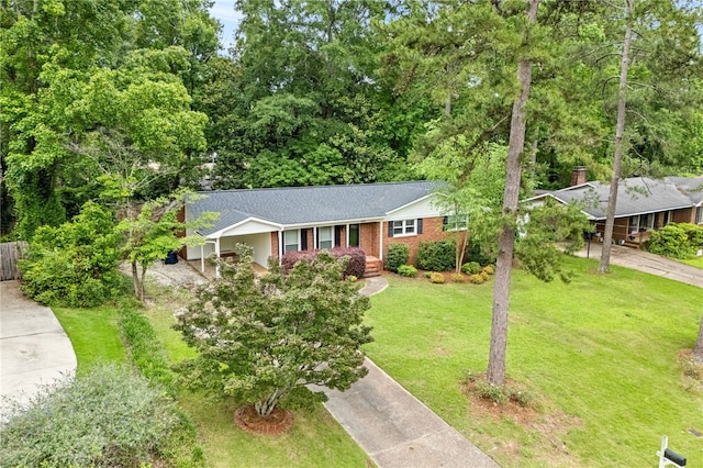 630 Apache St, Auburn, AL 36830 - ranch-style home featuring driveway, a front lawn, a shingled roof, and brick siding