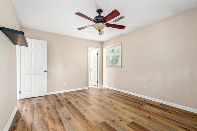 630 Apache St, Auburn, AL 36830 - unfurnished bedroom with wood finished floors and a ceiling fan