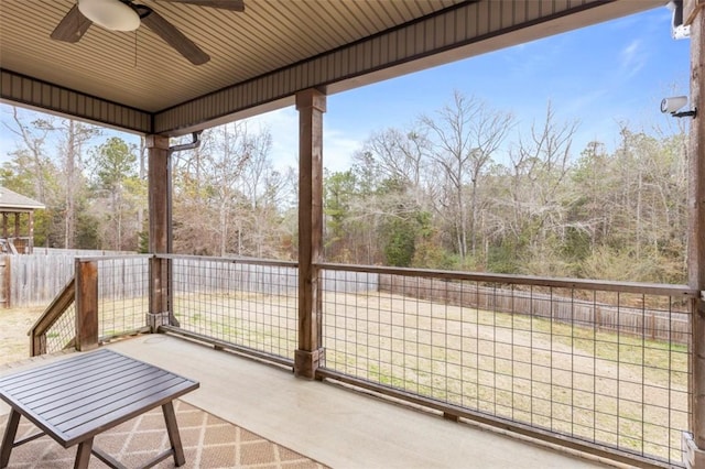 exterior space featuring ceiling fan