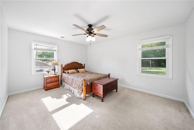 bedroom featuring baseboards, carpet, and a ceiling fan