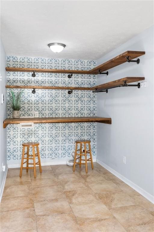 bar featuring baseboards