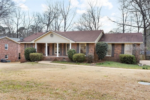 ranch-style home with covered porch, brick siding, crawl space, and a front yard