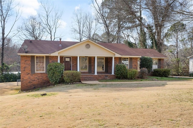 ranch-style house with a porch, crawl space, brick siding, and a front lawn