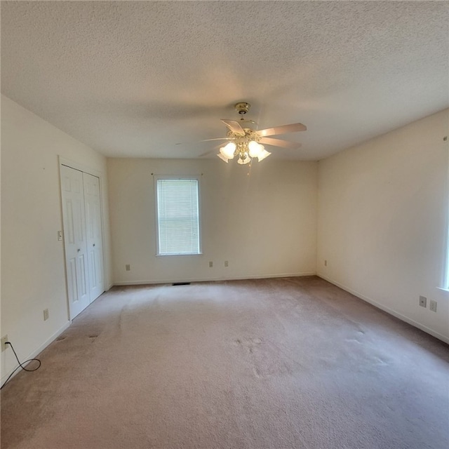 2521 28th Ave, Lanett, AL 36863 - unfurnished room featuring light carpet, ceiling fan, and a textured ceiling