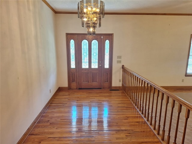 2521 28th Ave, Lanett, AL 36863 - entrance foyer featuring plenty of natural light, a chandelier, wood finished floors, and ornamental molding
