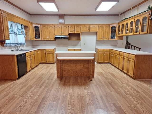 2521 28th Ave, Lanett, AL 36863 - kitchen featuring dishwasher, under cabinet range hood, light wood-style flooring, glass insert cabinets, and brown cabinetry
