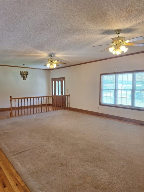 2521 28th Ave, Lanett, AL 36863 - carpeted empty room with a ceiling fan, a textured ceiling, crown molding, and a chandelier