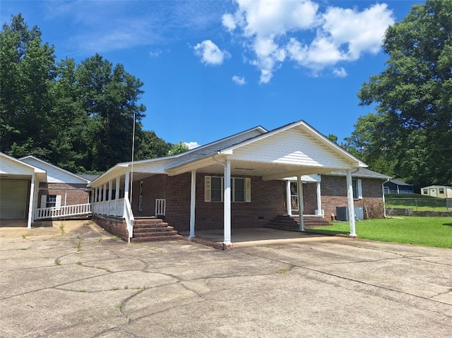 2521 28th Ave, Lanett, AL 36863 - view of front of house with driveway, an attached carport, and brick siding