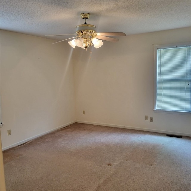 2521 28th Ave, Lanett, AL 36863 - carpeted spare room with a ceiling fan and a textured ceiling