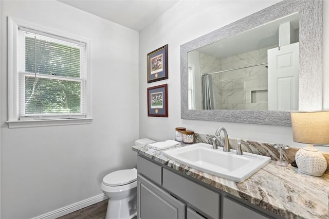 528 Genelda Ave Unit 19, Auburn, AL 36832 - bathroom with vanity, a shower with curtain, and wood finished floors