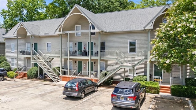 528 Genelda Ave Unit 19, Auburn, AL 36832 - view of property featuring stairway and uncovered parking