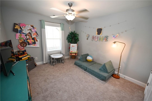 bedroom with baseboards, ceiling fan, and carpet