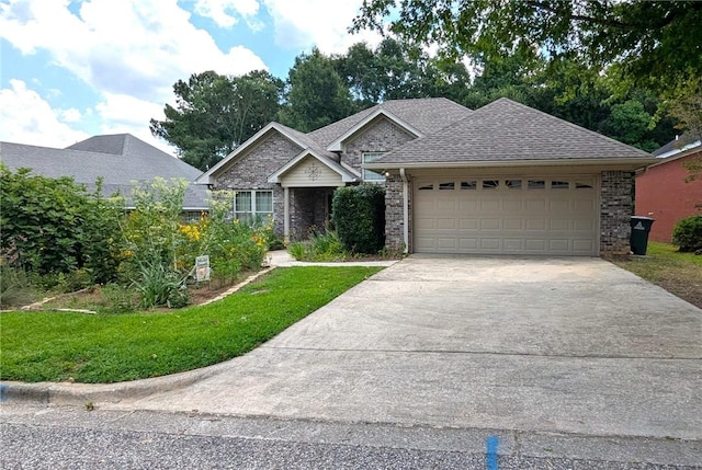 471 Arnell Ln, Auburn, AL 36830 - view of front facade featuring driveway, an attached garage, a front yard, and brick siding