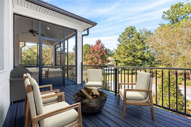 wooden deck featuring a sunroom