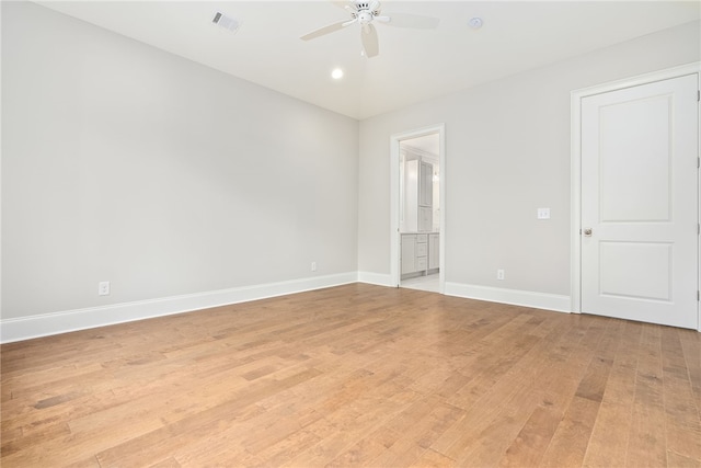 unfurnished room featuring ceiling fan and light hardwood / wood-style flooring