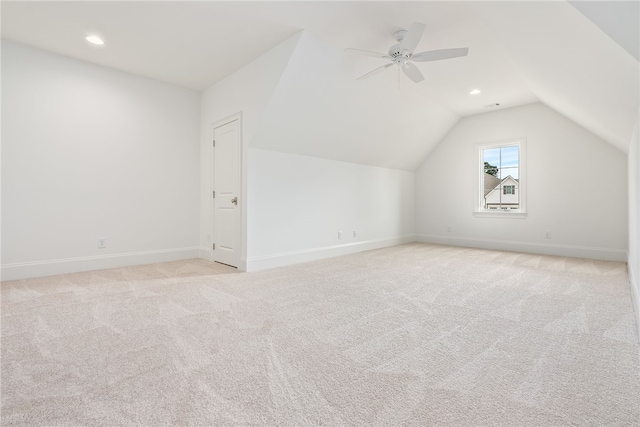 bonus room with light carpet, ceiling fan, and lofted ceiling