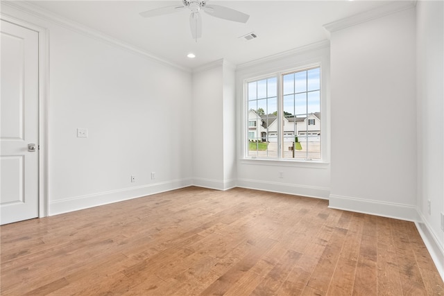 empty room with ceiling fan, light hardwood / wood-style floors, and ornamental molding