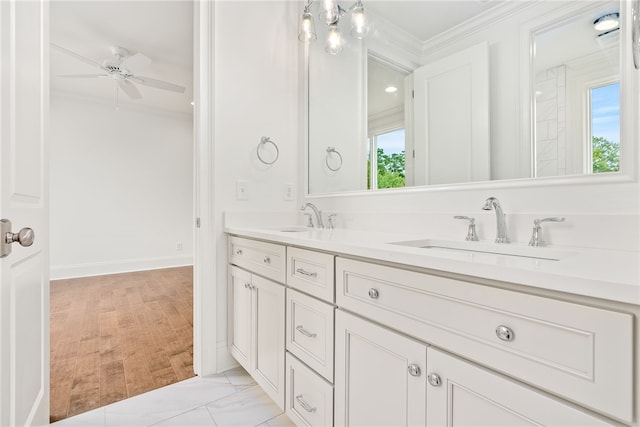 bathroom with vanity, a wealth of natural light, ornamental molding, and ceiling fan