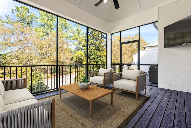 sunroom featuring ceiling fan