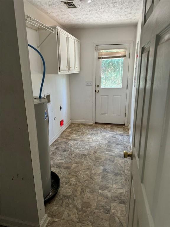 laundry area featuring cabinets, a textured ceiling, electric water heater, and electric dryer hookup