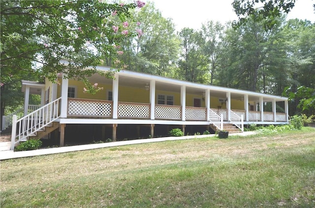 view of front facade with covered porch and a front lawn