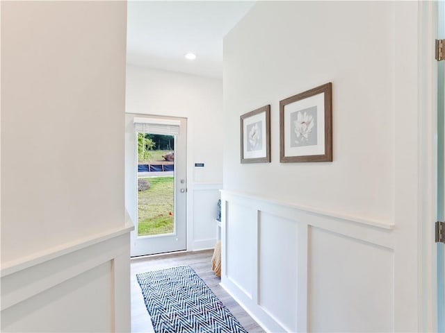 0103 Bradley Ln, Auburn, AL 36830 - doorway featuring wainscoting, light wood-style flooring, a decorative wall, and recessed lighting
