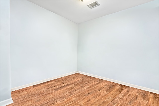 601 N Gay St Unit 202, Auburn, AL 36830 - empty room with light wood-style floors and baseboards