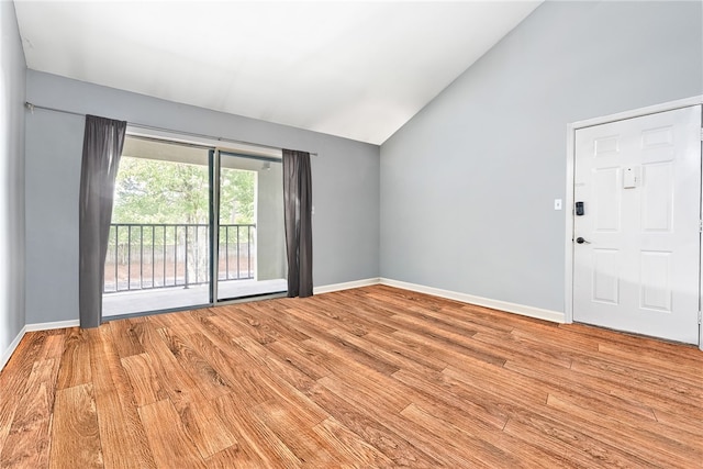 601 N Gay St Unit 202, Auburn, AL 36830 - empty room with vaulted ceiling and wood finished floors